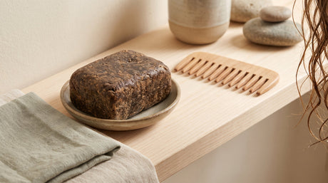 Sampson African Black Soap bar styled for scalp and hair care