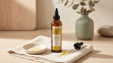 Pure Jojoba Oil bottle styled for daily lip and skin care