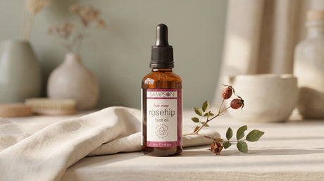 Rosehip Face Oil dropper bottle in a soft eco-luxury pregnancy skincare scene