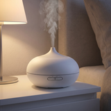 Ultrasonic essential oil diffuser, Bianca, cool mist on a bedside table